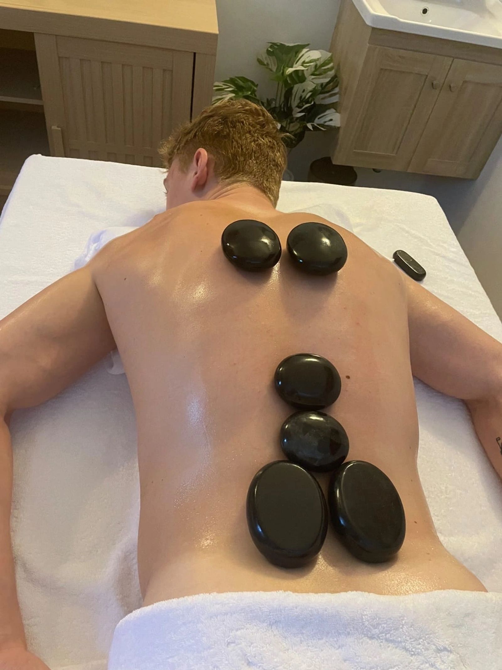 Therapist working on a client's shoulders
